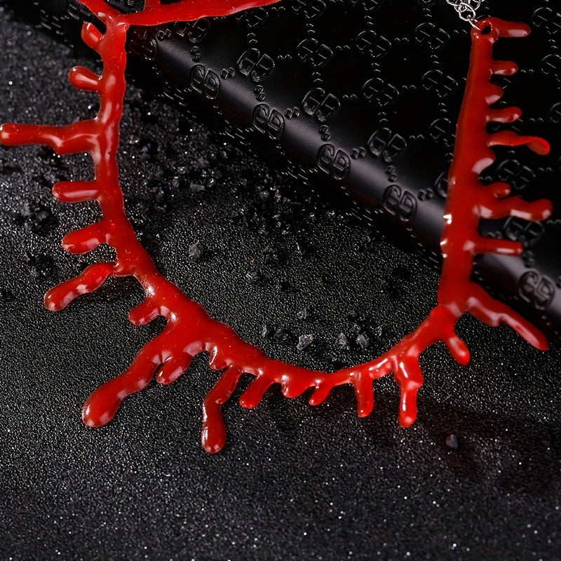 Red necklace on a black textured background