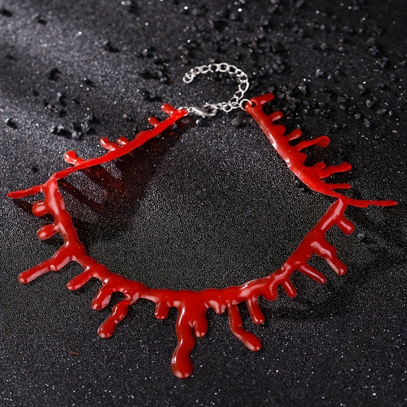 Red necklace with a chain on a black textured background