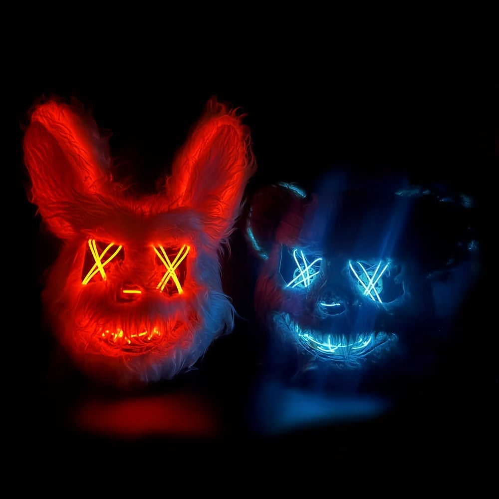 Two glowing masks, one red and one blue, on a black background.