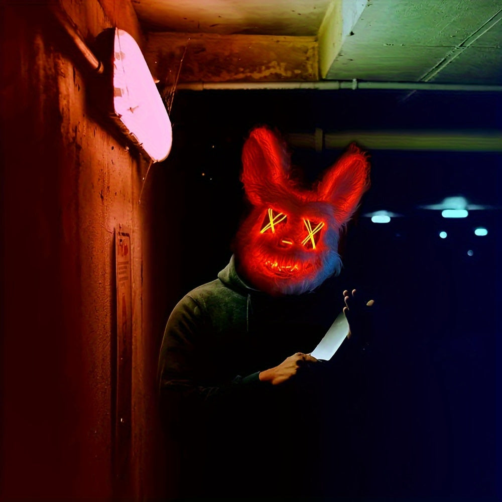 Person wearing a glowing red bunny mask in a dark alleyway